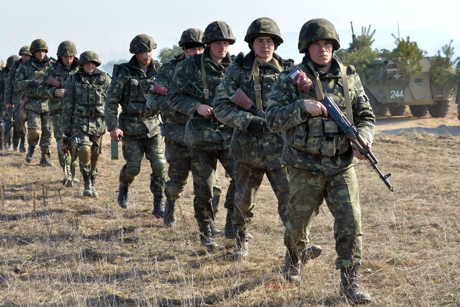 TOPSHOTS Ukrainian soldiers take part in a military drill not far from the small city of Goncharovskoye, some 150 km from Kiev, on March 14, 2014. Russia on March 14 declared it reserved the right to protect compatriots in the whole of Ukraine, seen as a threat that Moscow could move its forces beyond the Russian-speaking peninsula of Crimea.   AFP PHOTO / SERGEI SUPINSKYSERGEI SUPINSKY/AFP/Getty Images